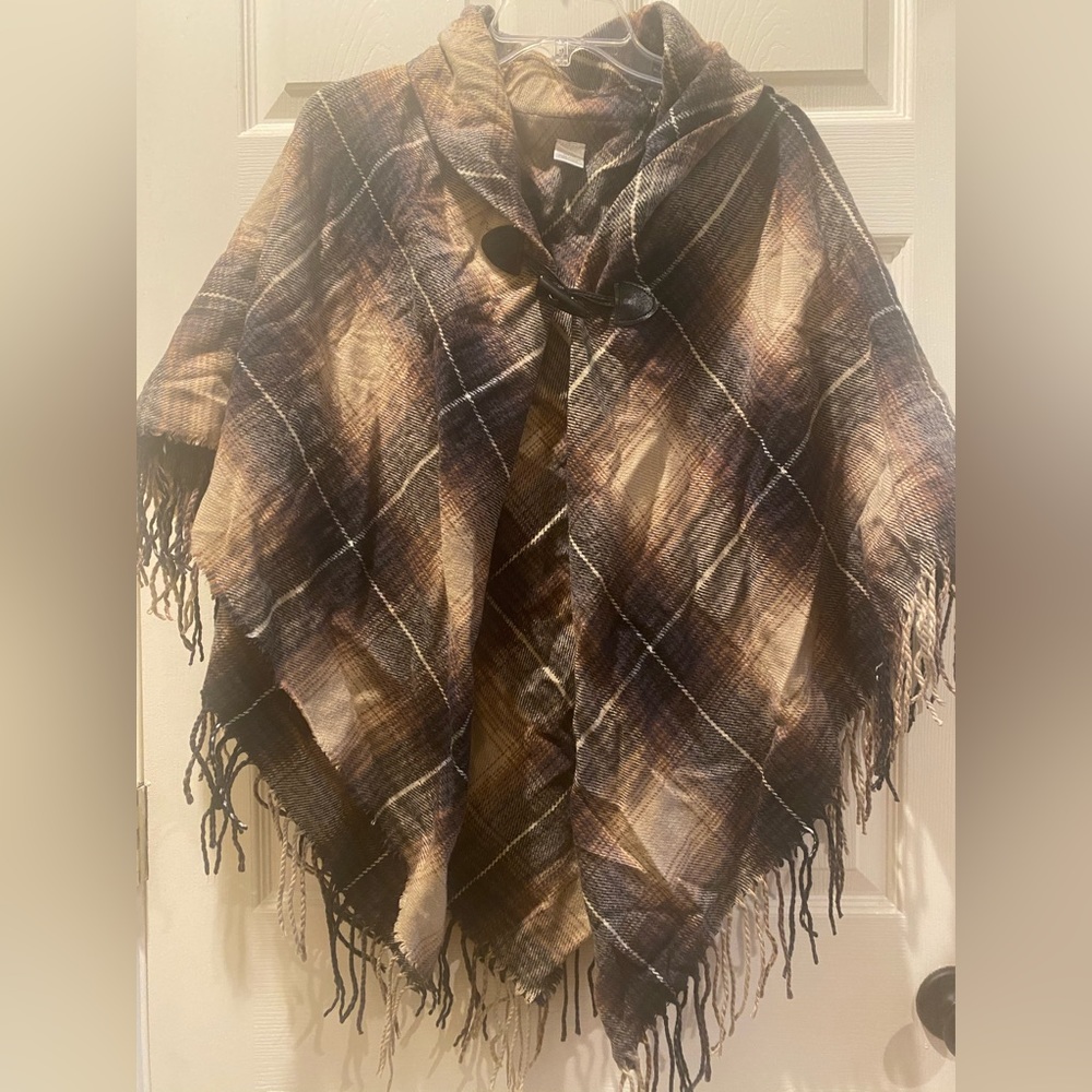 Poncho Shawl fastens in front.